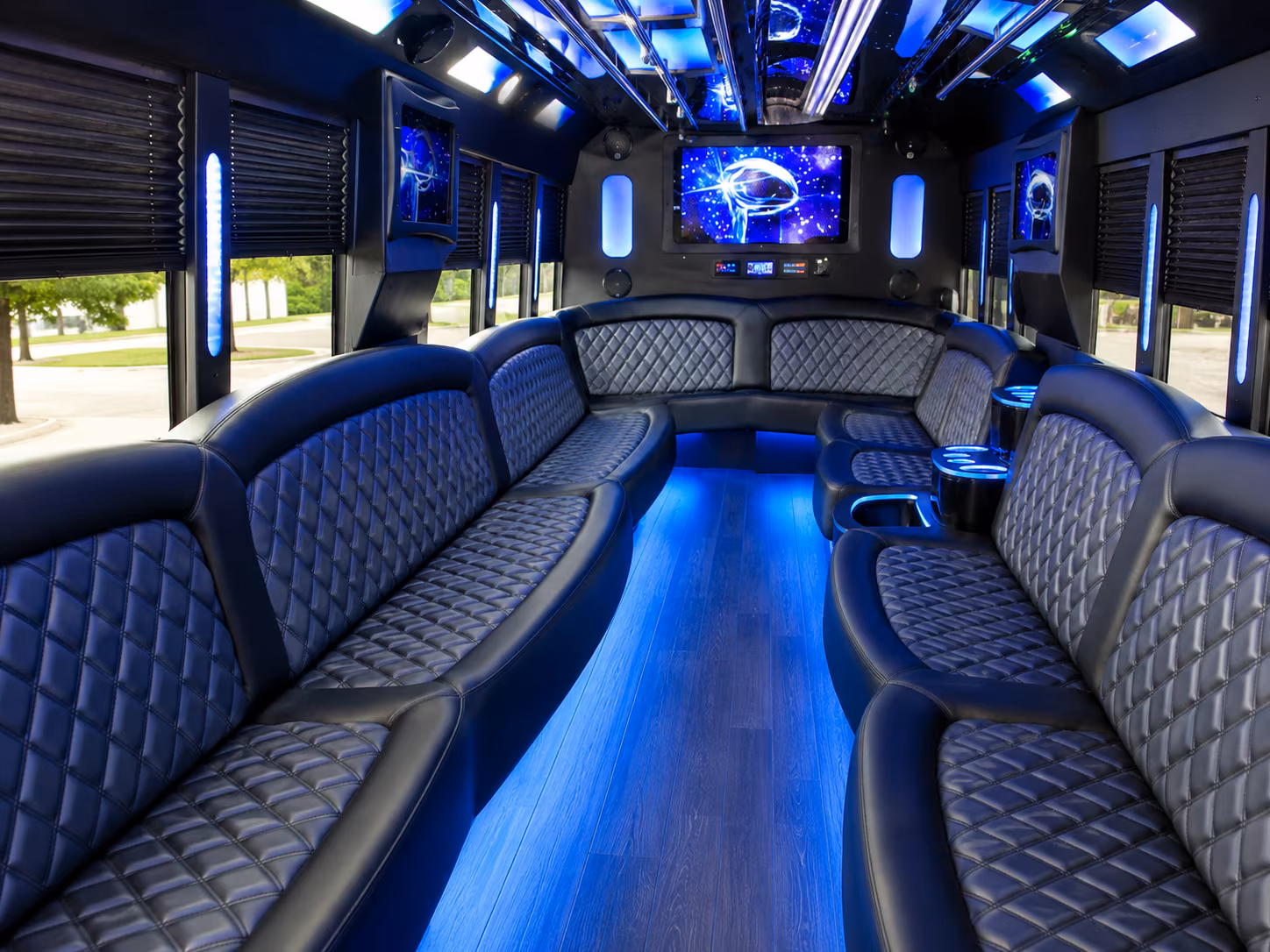 Wedding guests seated inside a party bus serving Fort Lee